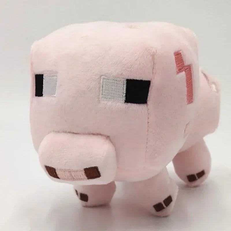 A soft pink stuffed dragon plush toy with black eyes and subtle orange accents.