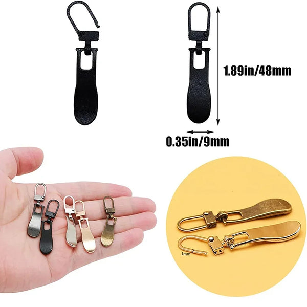 A set of replacement metal zipper pulls in black and gold colors shown next to a hand.