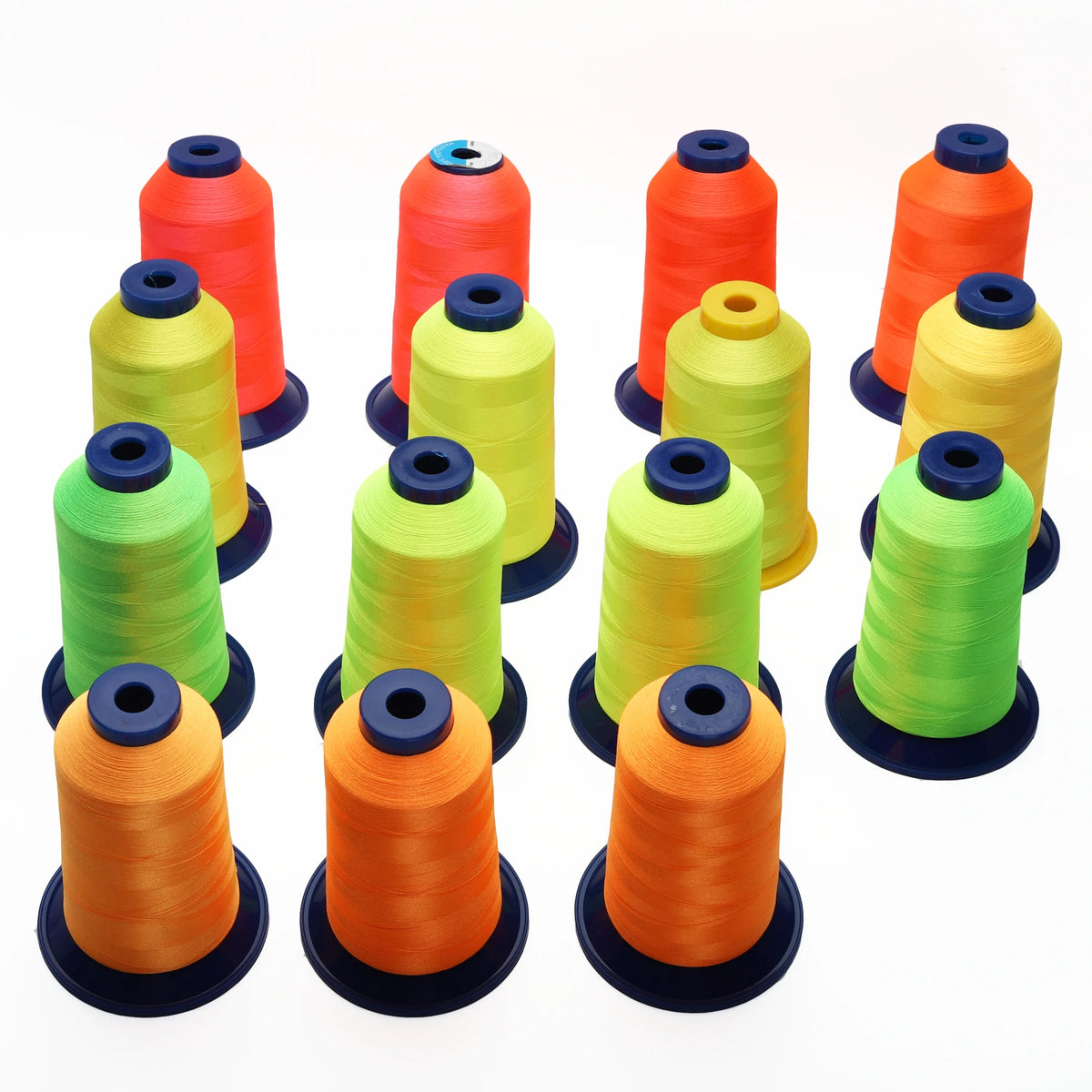 A collection of various colored high tenacity polyester embroidery threads in spools.