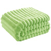 A rectangular light green flannel throw blanket with a textured, ribbed surface.