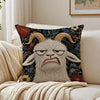 A decorative pillow featuring a realistic, grumpy-looking goat head with horns and a textured fur, set against a dark floral 