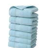 A stack of six light blue, textured cotton face towels.