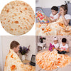 A child is wrapped in a funny burrito pizza blanket throw while sitting on a couch.