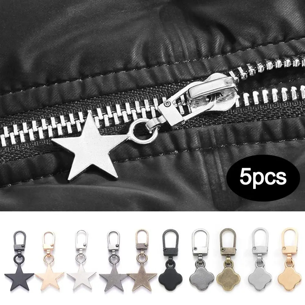 A set of five metal star and leaf zipper pulls for replacement on clothing or bags.