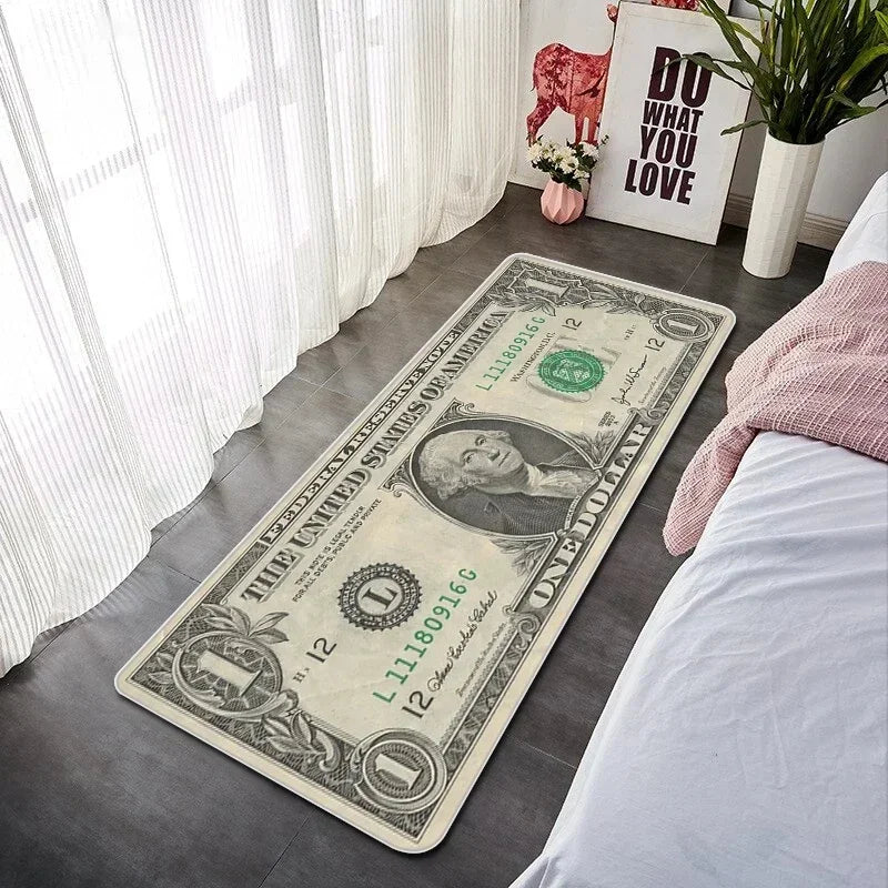 A decorative floor mat featuring a US one dollar bill and text on a gray floor.