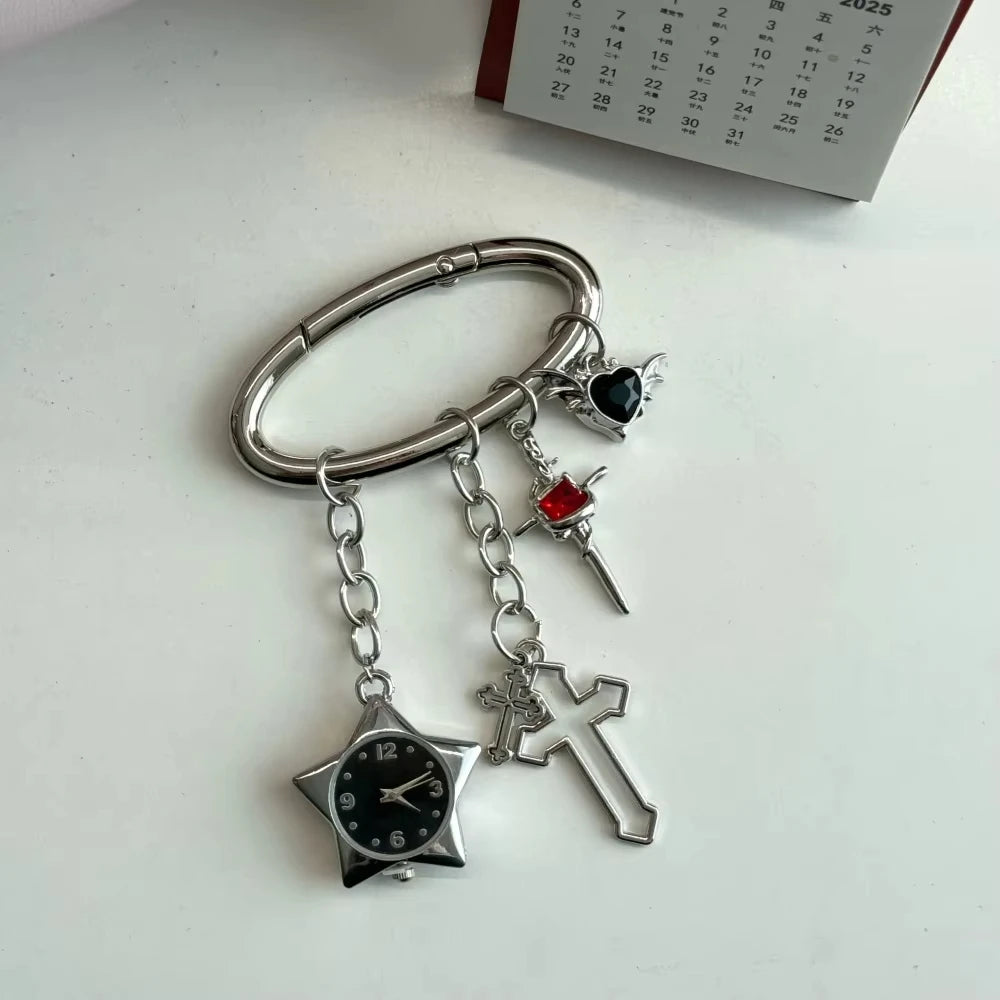 Silver adjustable watch keychain featuring a star-shaped watch face and a cross charm.