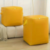 A bright yellow extra-large heavy-duty waterproof storage bag with reinforced handles sitting on a wooden floor.