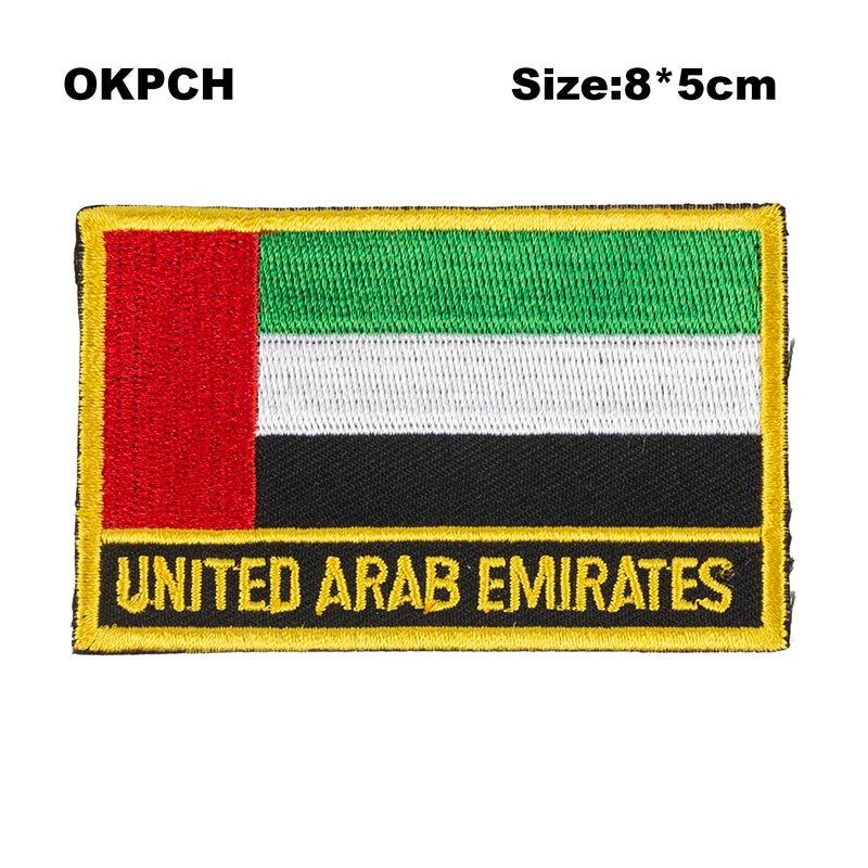 An embroidered patch of the flag of the United Arab Emirates featuring red, white, and green horizontal stripes.