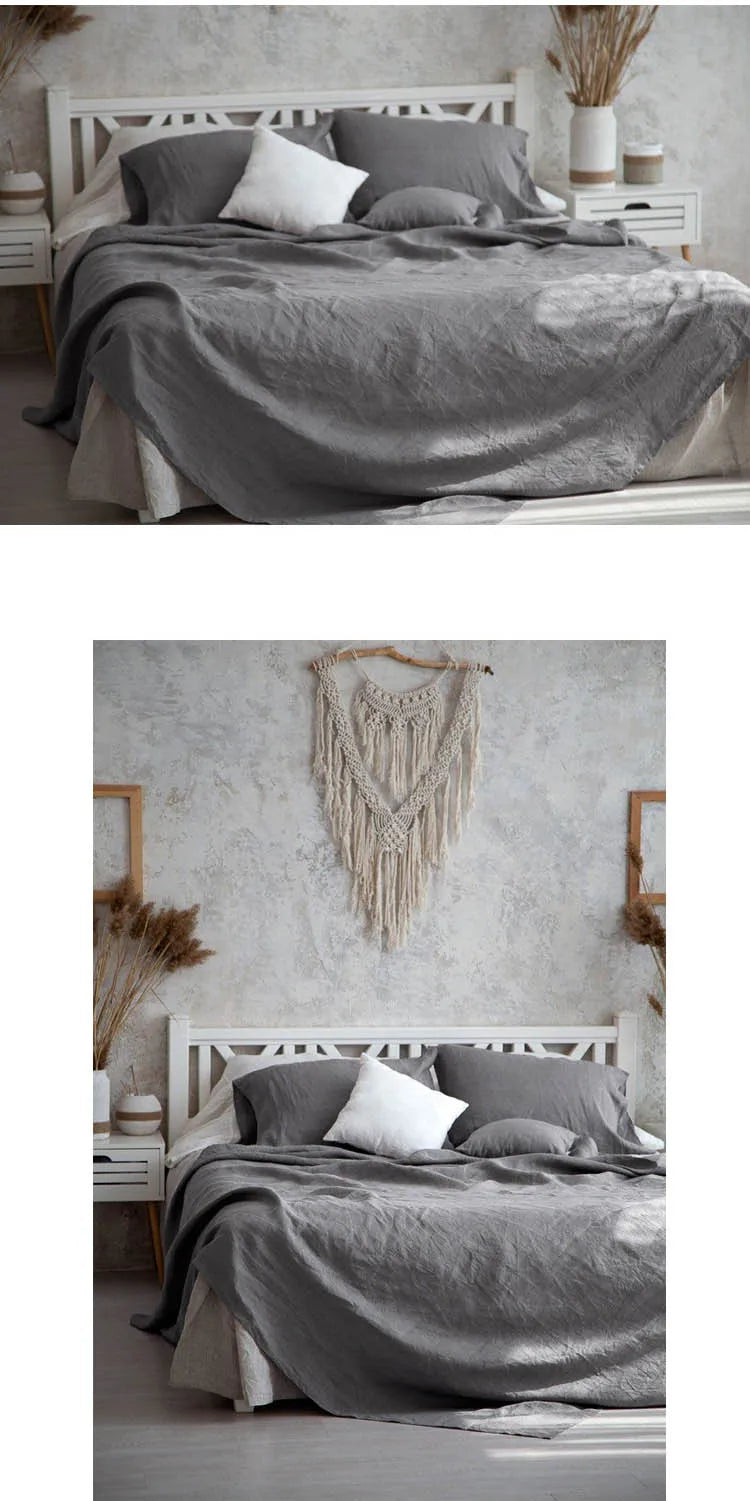 A bed dressed with a gray linen flat sheet and pillows in a bright, rustic bedroom setting.