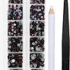 A clear plastic container holds various shades of dark red and black crystal rhinestones for crafting or jewelry making.