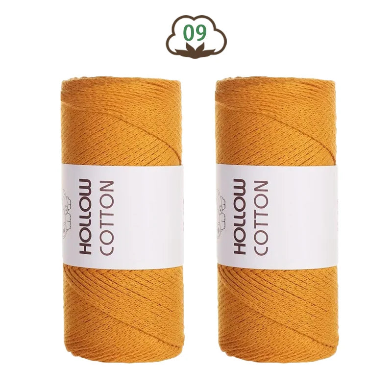 Two spools of yellow hollow cotton yarn for DIY crafting