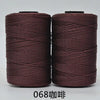 Two spools of dark reddish-brown hand knitting and crochet cord for crafting