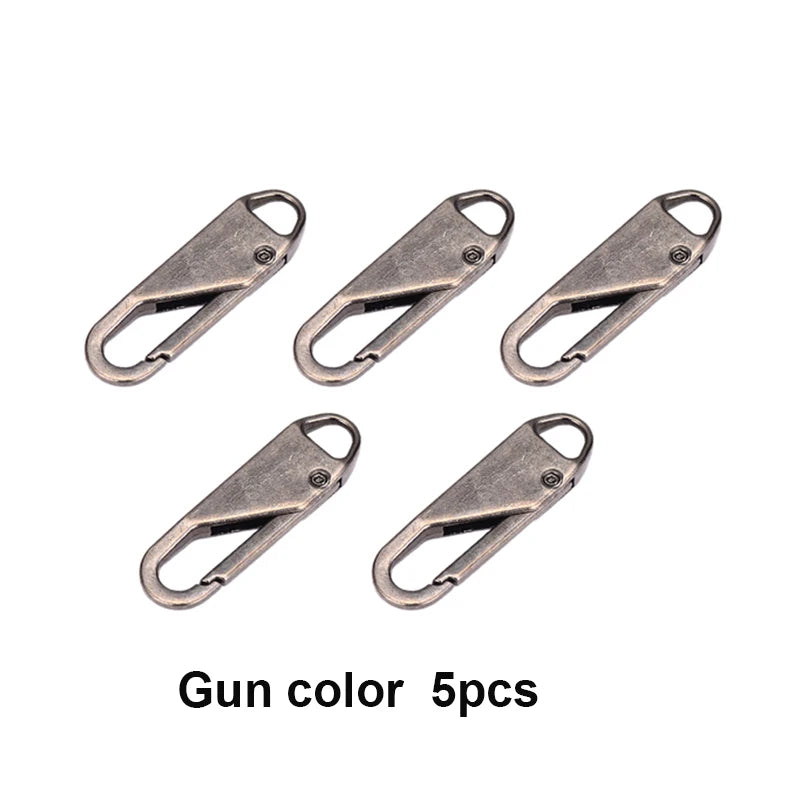 Five pieces of gun color metal zipper repair sliders or toggles.
