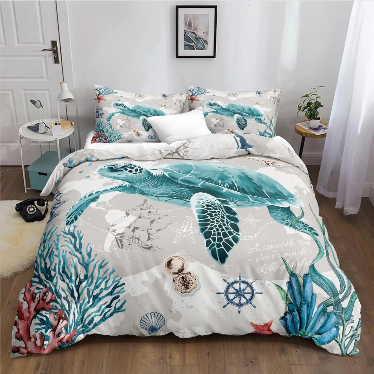 A sea turtle themed duvet cover set featuring teal and white illustrations of sea life on a bed.