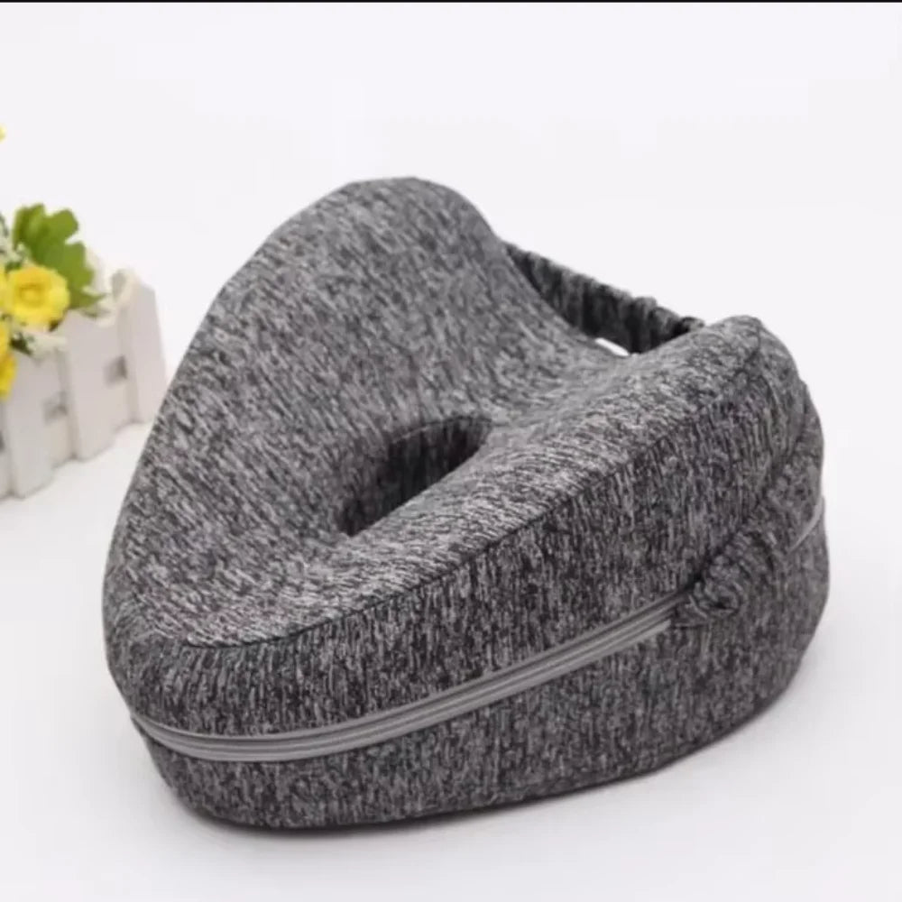 A gray memory foam heart-shaped pillow designed for side sleepers and pregnancy support.
