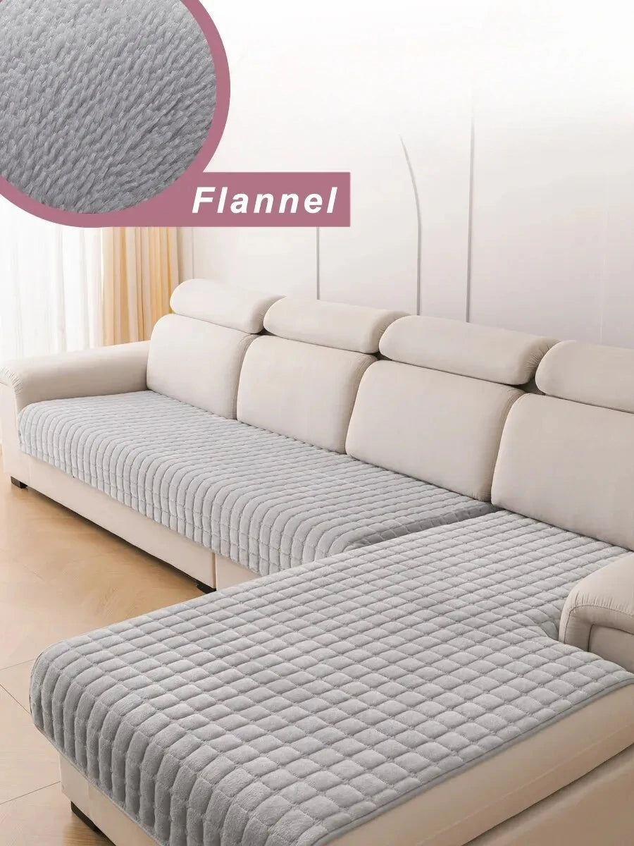 A light gray flannel sofa cover is displayed on a beige L-shaped corner sofa, showing the textured fabric detail.