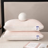 A stack of two white textured cooling therapy pillows resting on a light surface.