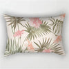A decorative pillowcase featuring a tropical leaf print with pink and green foliage.