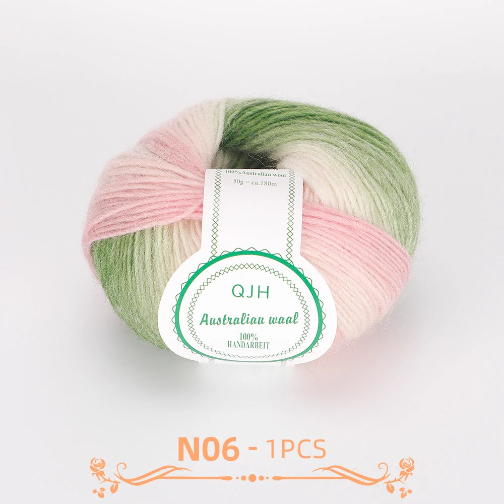 A ball of multi-colored Australian wool yarn featuring pink, green, and cream tones.