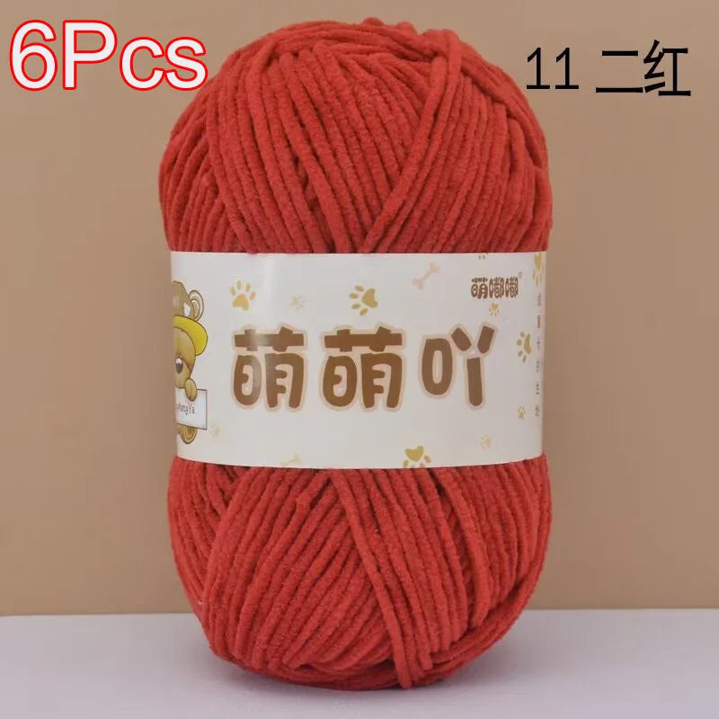 A ball of 6 pieces of orange chenille yarn labeled in Chinese characters for crochet and knitting.