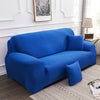 A vibrant royal blue elegant faux silk sofa cover displayed on a light-colored rug.