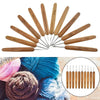 A set of wooden bamboo crochet and knitting needles with various sizes displayed alongside yarn.