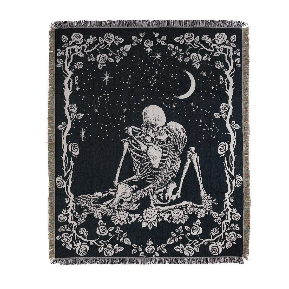 A black throw blanket featuring a white line art design of a skull, branches, and a crescent moon.