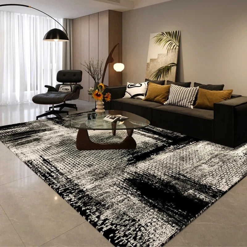 A black and white geometric non-slip area rug is displayed in a modern living room setting.