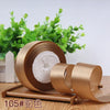 Roll of 4 cm wide satin ribbon in a gold color for gift wrapping and DIY crafts