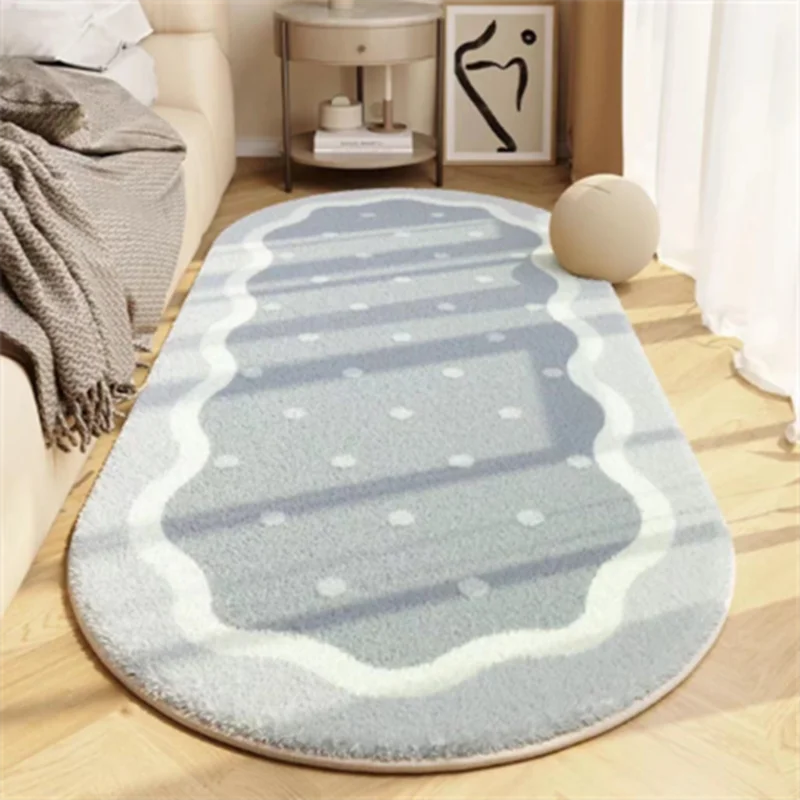 A light blue and white striped rug with a scalloped edge placed on a wooden floor.