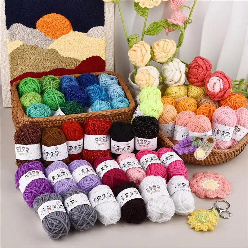 A collection of 12-color soft acrylic yarn balls in various shades of green, orange, pink, and purple arranged in a wooden ba