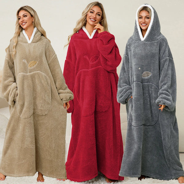 Three women modeling oversized plush hooded blankets in beige, red, and gray colors