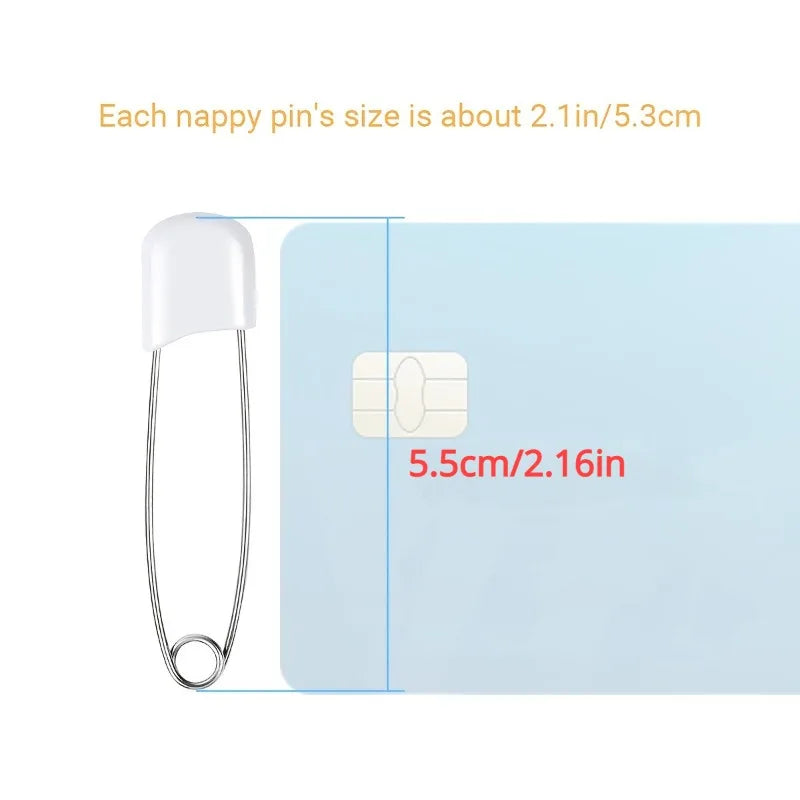 A white plastic diaper pin is shown next to a rectangular stainless steel diaper pin, with size measurements provided.