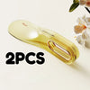 Two yellow silicone mattress lifters or bed linen organizers are shown on a light background.