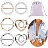 A collection of round heart button clips in various metals and finishes, including silver, gold, and pearl-like designs.