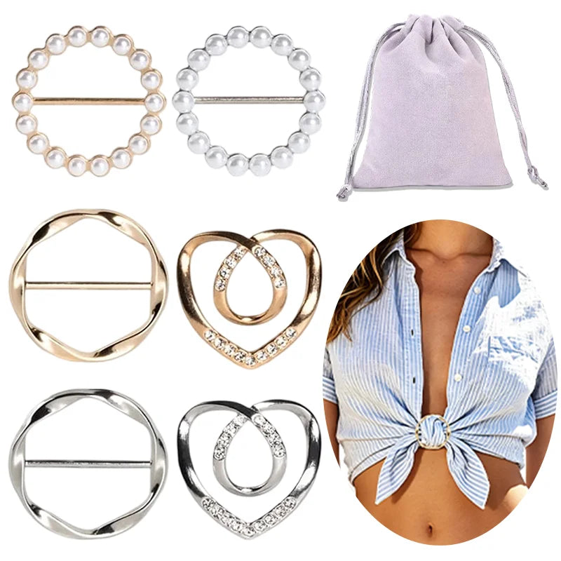 A collection of round heart button clips in various metals and finishes, including silver, gold, and pearl-like designs.