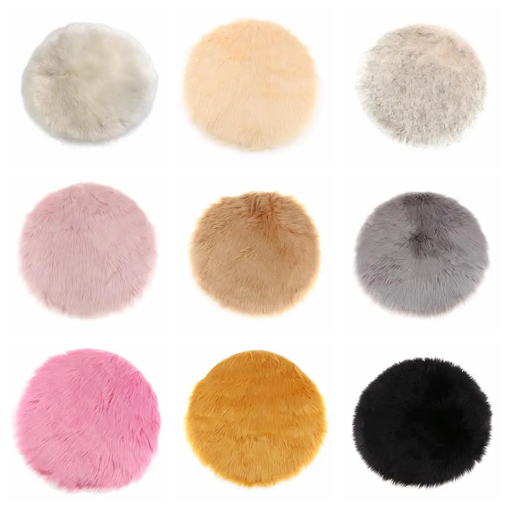 A collection of round faux fur sheepskin rugs in various shades including beige, pink, gray, and black.