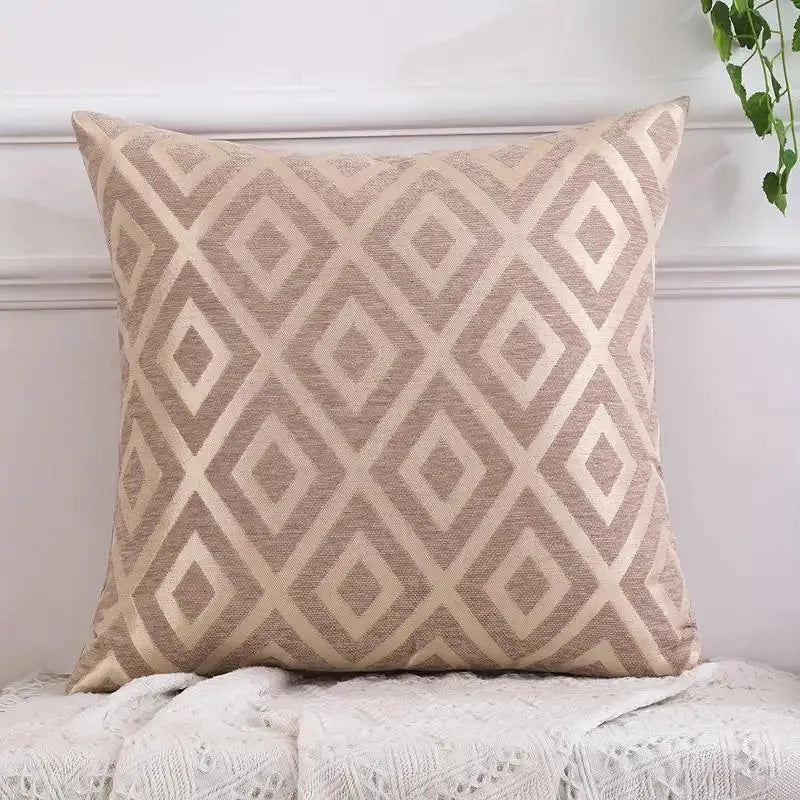 A beige chenille jacquard throw pillowcase featuring a diamond pattern resting on a white surface.
