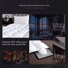 A white goose down duvet shown in various contexts, including a bed and a heating pad.