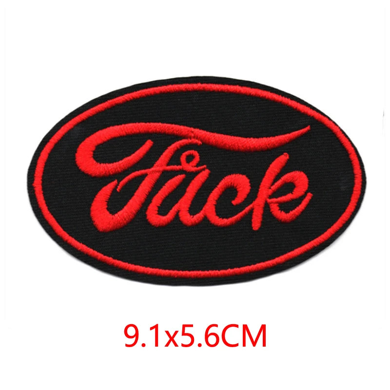 Black oval iron-on embroidered patch with the word Fuck in red script