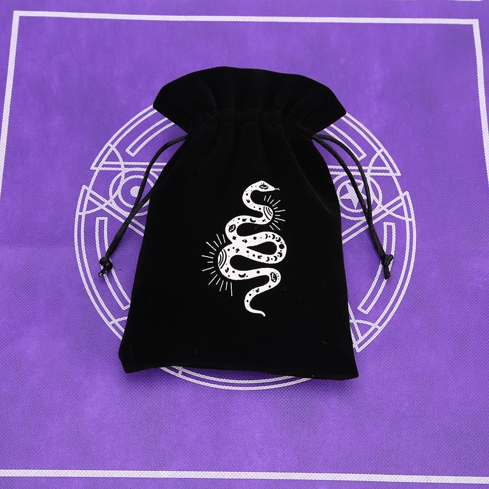 Black velvet tarot cards storage pouch with a white coiled snake design on a purple background