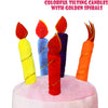 Colorful tilting candles with golden spirals on a pink surface for party decor
