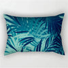 A dark teal and blue tropical leaf print decorative pillowcase.
