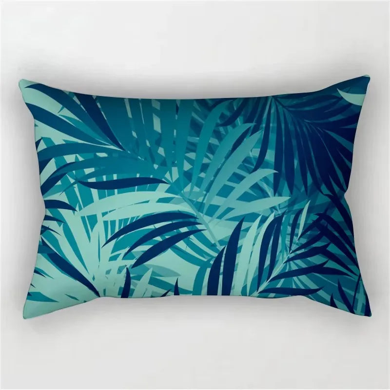 A dark teal and blue tropical leaf print decorative pillowcase.