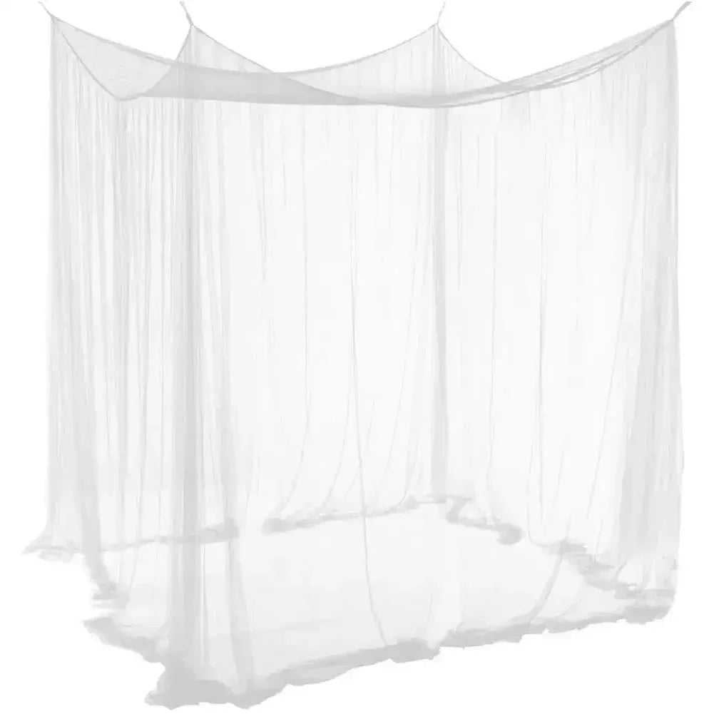 A sheer white mosquito net canopy draped over a bed frame.