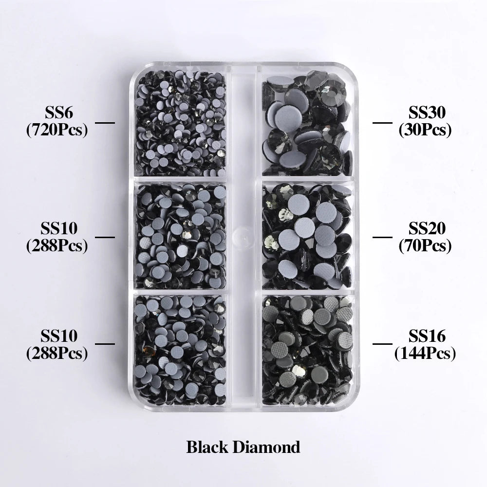 A clear plastic tray holds various sizes of black diamond glass rhinestones categorized by SS6, SS10, SS16, SS20, and SS30.