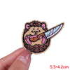 An embroidered patch featuring a cartoon animal with brown fur and pink accents.