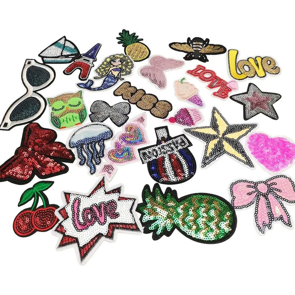 A collection of 30 multi-style iron-on embroidery patches featuring various designs and colors.