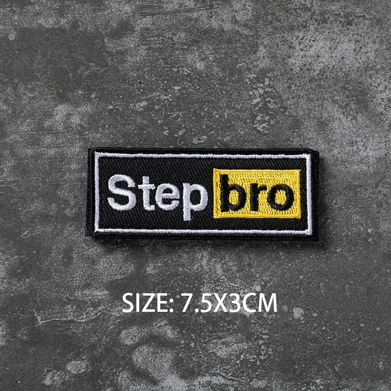 Black embroidered badge with yellow text Stepbro on a dark gray textured background