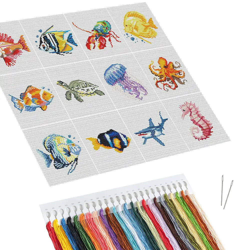 A cross stitch kit featuring various fish and sea creatures in colorful embroidery thread.